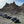 A lineup of off-road vehicles parked at the base of the Trona Pinnacles rock formations during the Valentines Overland Experience 2025 adventure.