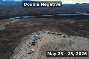 Aerial drone photo showing a group of overland vehicles camping in a remote desert ridge above winding canyons during the Weekend Offroad Double Negative event in May 2026.