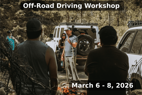 Instructor teaching winching techniques and off-road safety to participants during the Weekend Offroad Driving Workshop held March 6-8, 2026, with a white 4x4 recovery vehicle in the background.