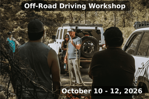 Instructor teaching winching techniques and off-road safety to participants during the Weekend Offroad Driving Workshop held October 10–12, 2026, with a white 4x4 recovery vehicle in the background.