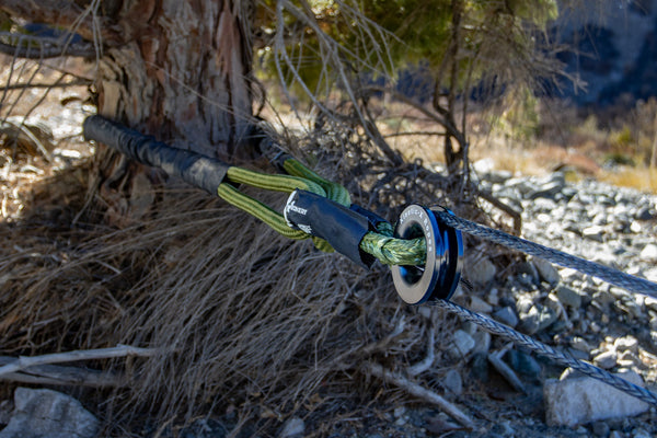 Close-up of a proper off-road recovery setup using a tree saver strap, soft shackle, and snatch ring during the Trail Recovery & Emergency Skills Workshop.
