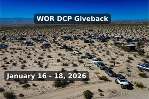 Aerial view of the Weekend Offroad DCP Giveback 2026 event with overlanding vehicles and tents spread across the desert.