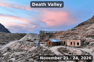 Death Valley event banner showing an abandoned mining site with wooden buildings and desert hills at sunset, labeled “Death Valley” and dated November 21–24, 2026.