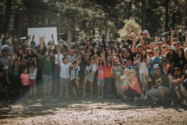 Weekend Offroad family overlanding and off-road training event with kids, parents, and outdoor enthusiasts gathered in the forest.